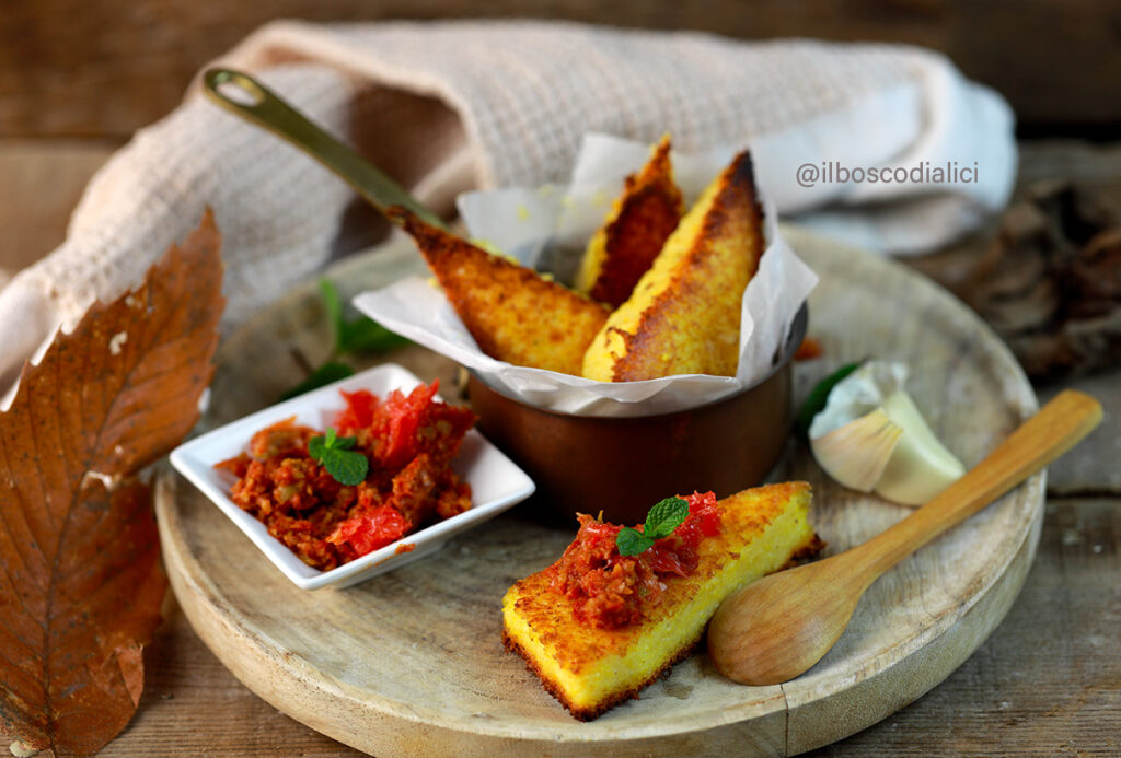 Crispy polenta cakes with green olive, grapefruit and sun-dried tomato tapenade